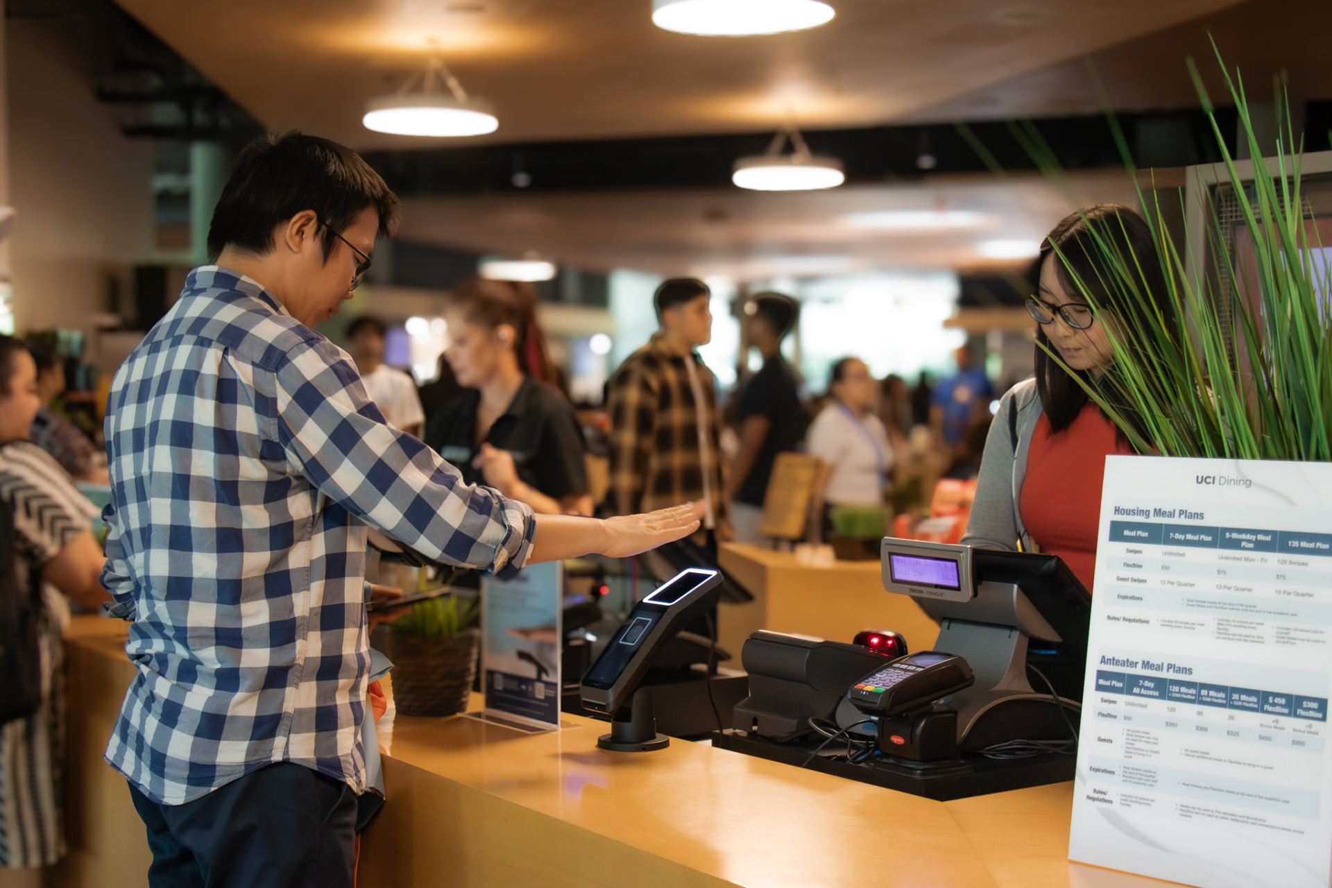 student checks in at Brandywine Commons using Amazon One palm recognition technology.