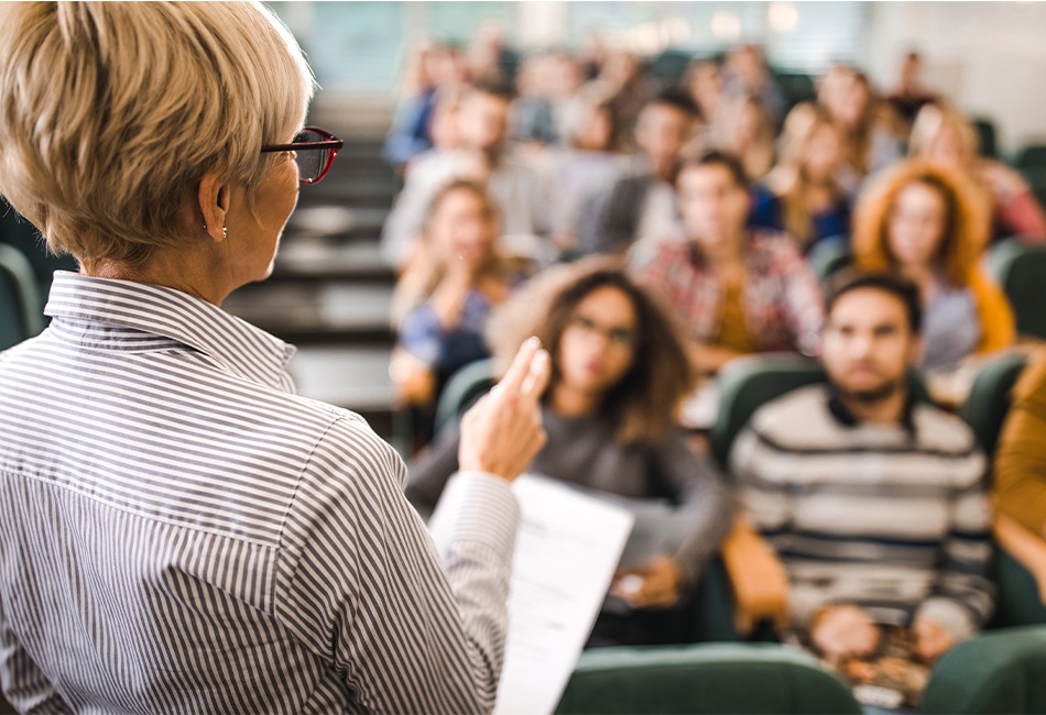 woman speaking in front of class