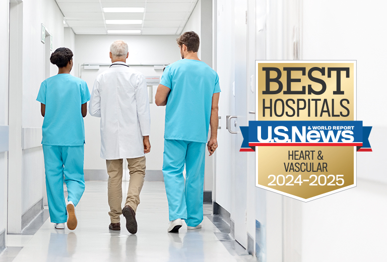 medical team walking down hospital hallway with badge for U.S. News and World Report Best Hospitals Heart and Vascular 2024-2025