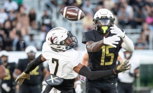 UCF receiver Tyree Patterson (15) bobbles the ball while covered by defensive back Antione Jackson (7) during the annual spring game at FBC Mortgage Stadium. (Willie J. Allen Jr./Orlando Sentinel)