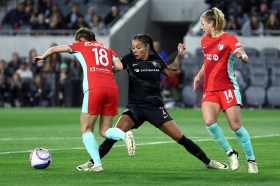 Angel City FC forward Sydney Leroux, center, vies for the ball against Kansas City defender Izzy Rodriguez. The Current are tied with Orlando for NWSL's best record at 10-0-5. (Raul Romero Jr./SCNG)