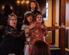 The harried wedding planner (Samuel Wetherbee, background) watches the shenanigans of Aunt Assunta, Maria and maid of honor Rosemary (Jac LeDoux, from left, Felicia Thornsbury and Sarah Lockard). (Courtesy Chris Bridges via Phantasmagoria)