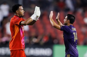 Orlando City goalkeeper Pedro Gallese (left) and midfielder Nico Lodeiro celebrate their victory at Toronto on Wednesday night. (Cole Burston/The Canadian Press)