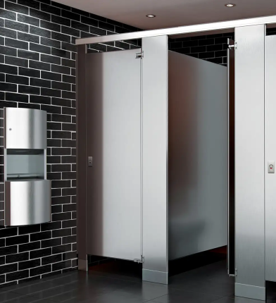 ASI Stainless Steel Toilet Partitions in a Black Titled Bathroom with a Stainless Steel Paper Towel Dispenser and Trashcan on the wall