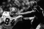 New Orleans Saints football player Eric Martin gets a hand in the face as he tries to push off the pursuit of Atlanta Falcons' Charles Dimry. Eliot Kamenitz / Nola.com | The Times-Picayune