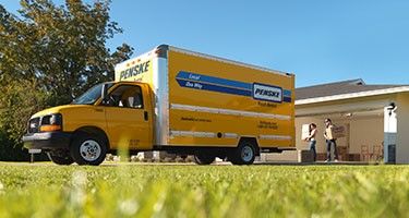 Family loading a moving truck