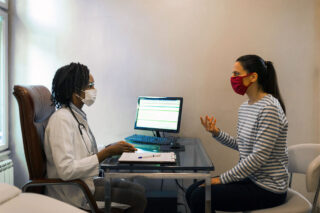 photo - Doctor Listening to Patient