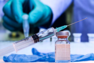 photo - Syringe and Vaccine Vial