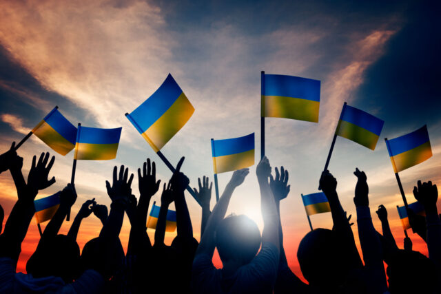 photo - Group of People Waving Ukranian Flags