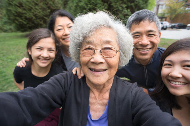 photo - Asian-American Grandmother, Children, and Grandchildren Pose for a Selfie