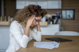 photo - Woman Looking Worried over Bills