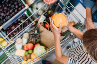 photo - Child Helping Parent with Shopping