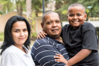 photo - Hispanic Family Looking at Camera