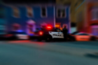 photo – Blur Background of Police Cars at Night