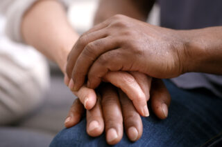 photo - Couple Holding Hands for Support and Help