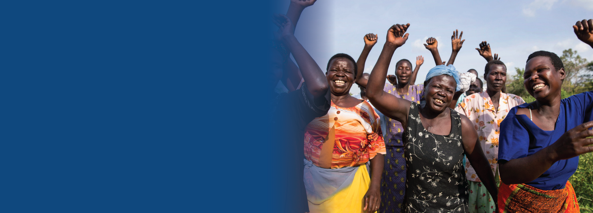 Ugandan women walking and cheering