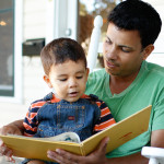 Father and son practicing dos and don'ts of reading skills