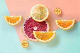 slices of oranges and grapefruit on a colorful background