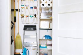 Organized Utility Closet With Shelves and Hanging Storage