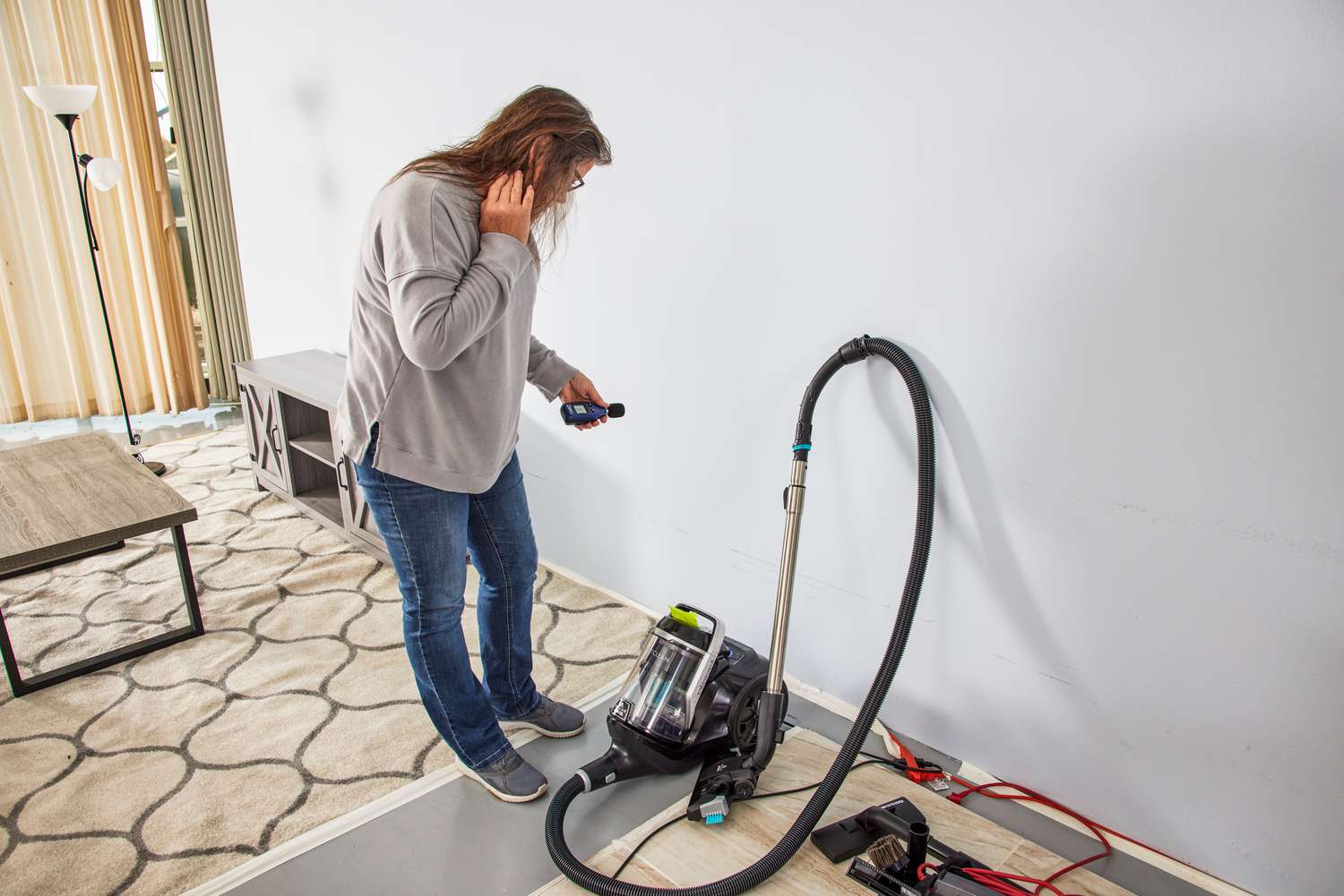 A person assembles the Bissell SmartClean Canister Vacuum