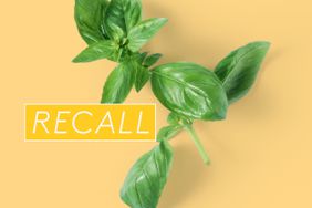 sprig of basil with a recall logo on it