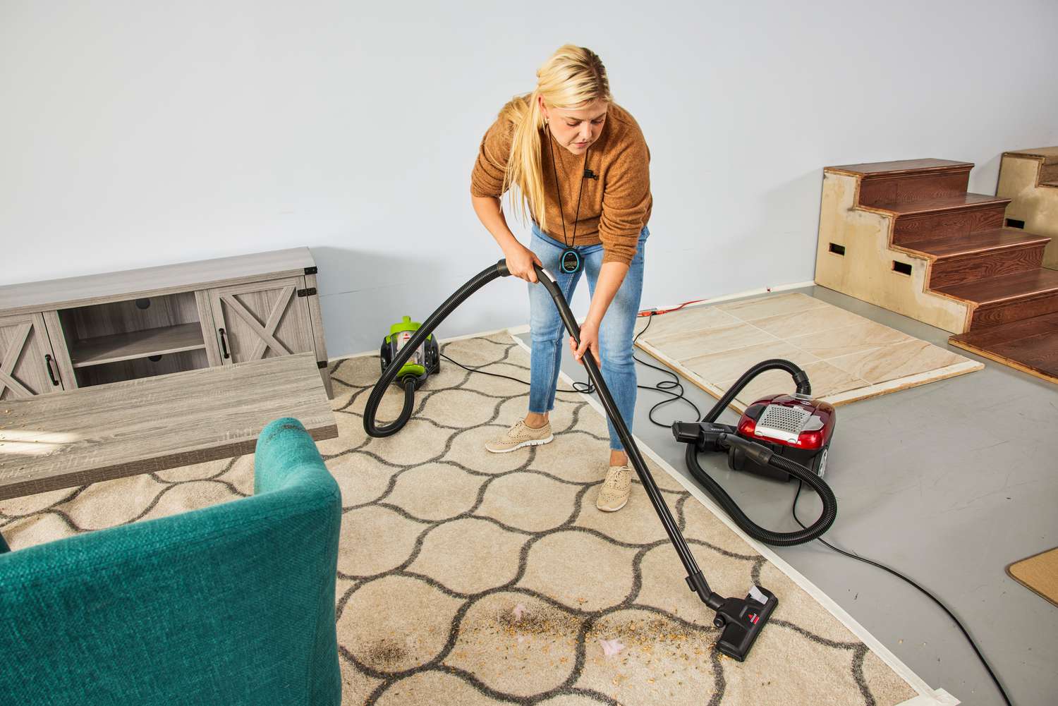 A person uses the Bissell Zing Bagless Canister Vacuum, 2156A on carpet