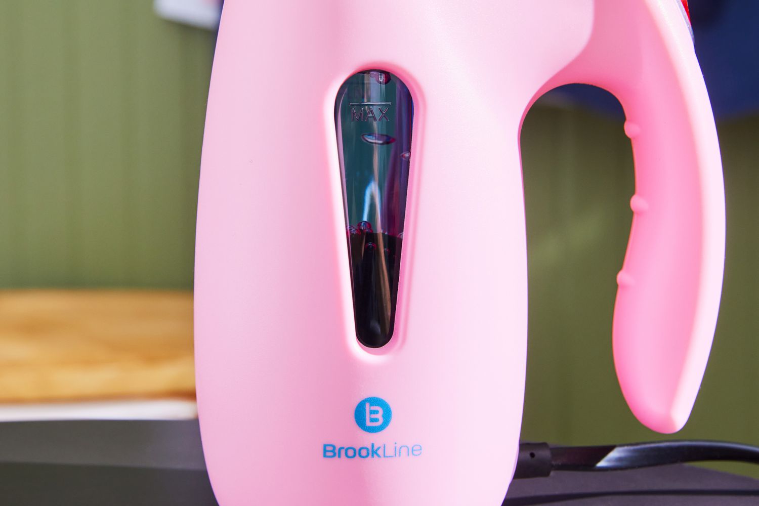 Close-up of the water level in the Brookline Handheld Garment Steamer's water tank.