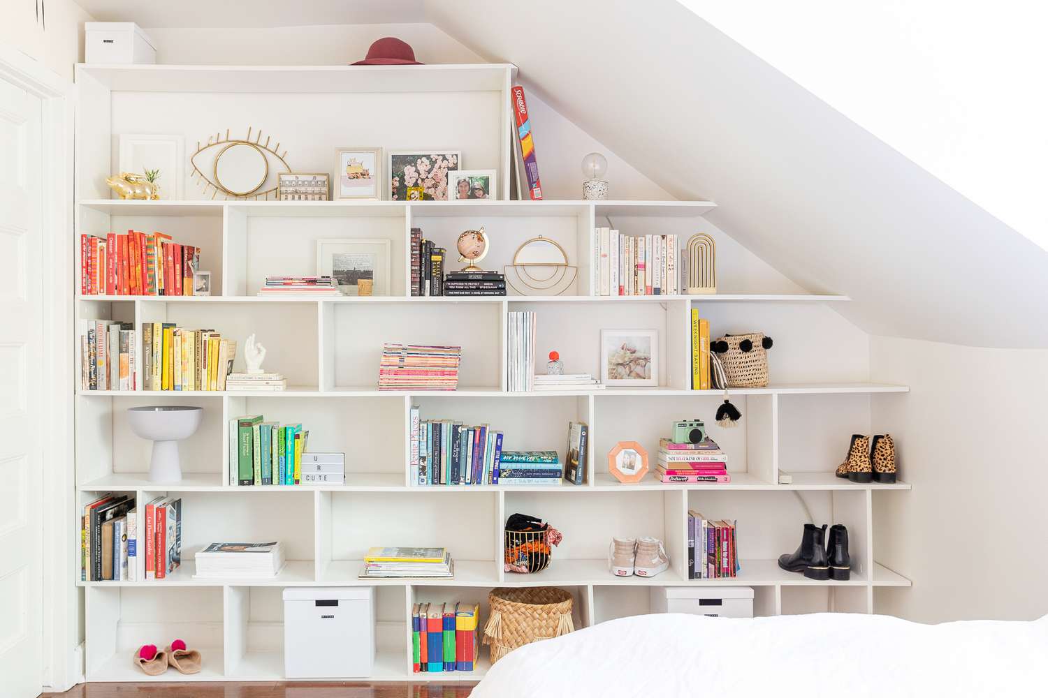 white bookshelf with colorful decor