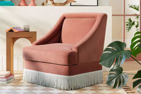 Alberhill Velvet Accent Chair with Fringe Displayed in a living room 