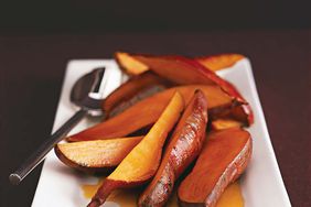 Vanilla Sweet Potatoes on White Serving Plate with Metal Spoon