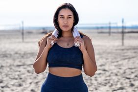 What Happens When You Wear a Sports Bra All Day Every Day: woman wearing a sports bra at the beach