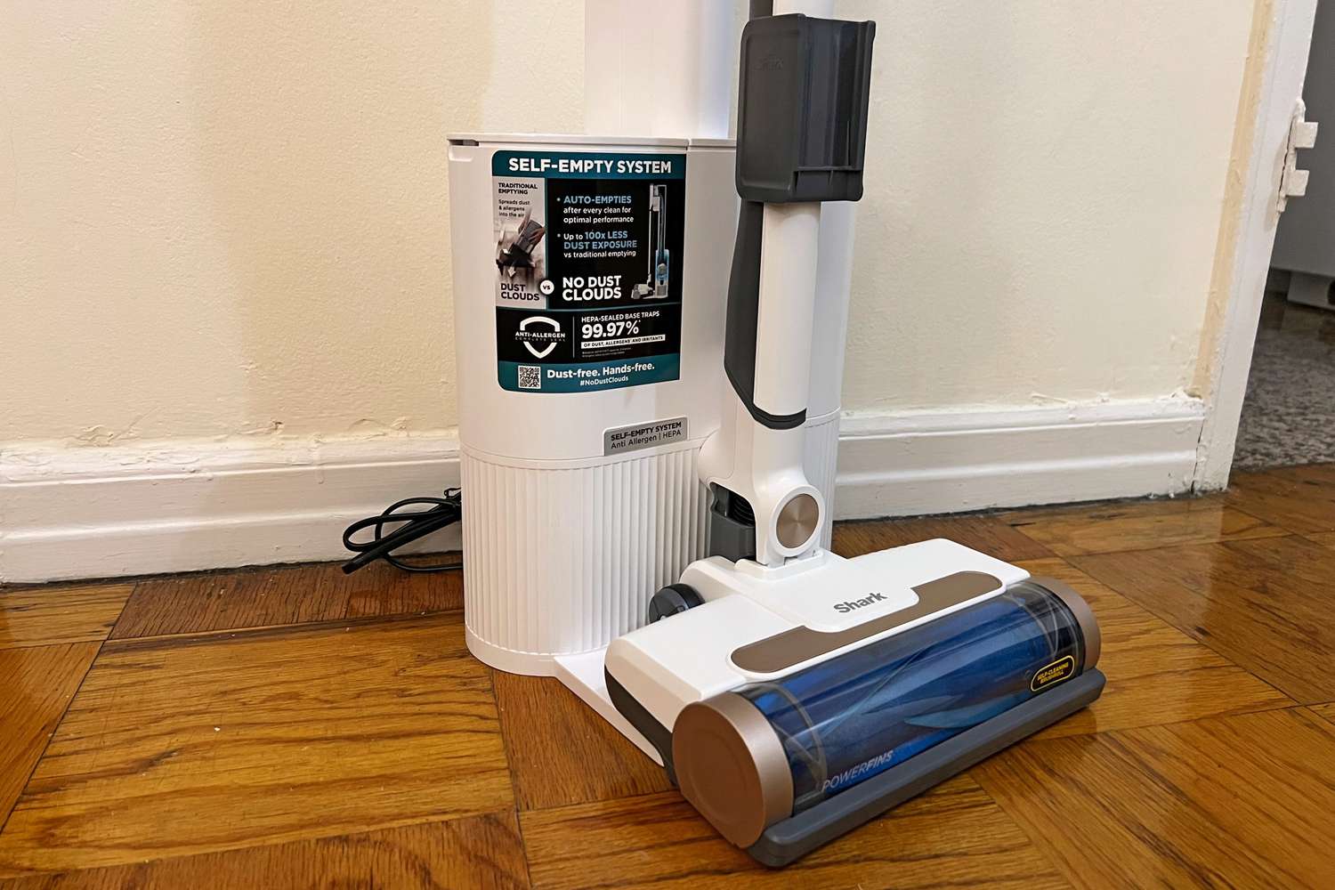 Closeup of the Shark Wandvac Cordless Stick Vacuum and it's Self-Empty Charging Base.