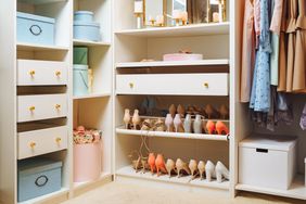 White closet with gold knobs and pastel colored shoes, dresses, and accessories.