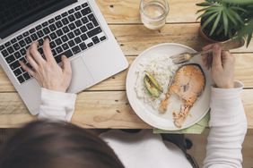 person attending a digital dinner party over video