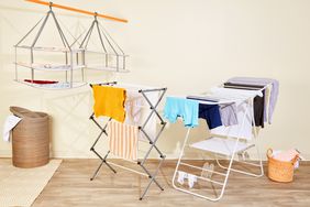 Three of the best clothes drying racks displayed together with clothes on them. 
