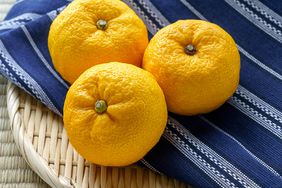 Japanese citron 'Yuzu' fruits isolated on light background