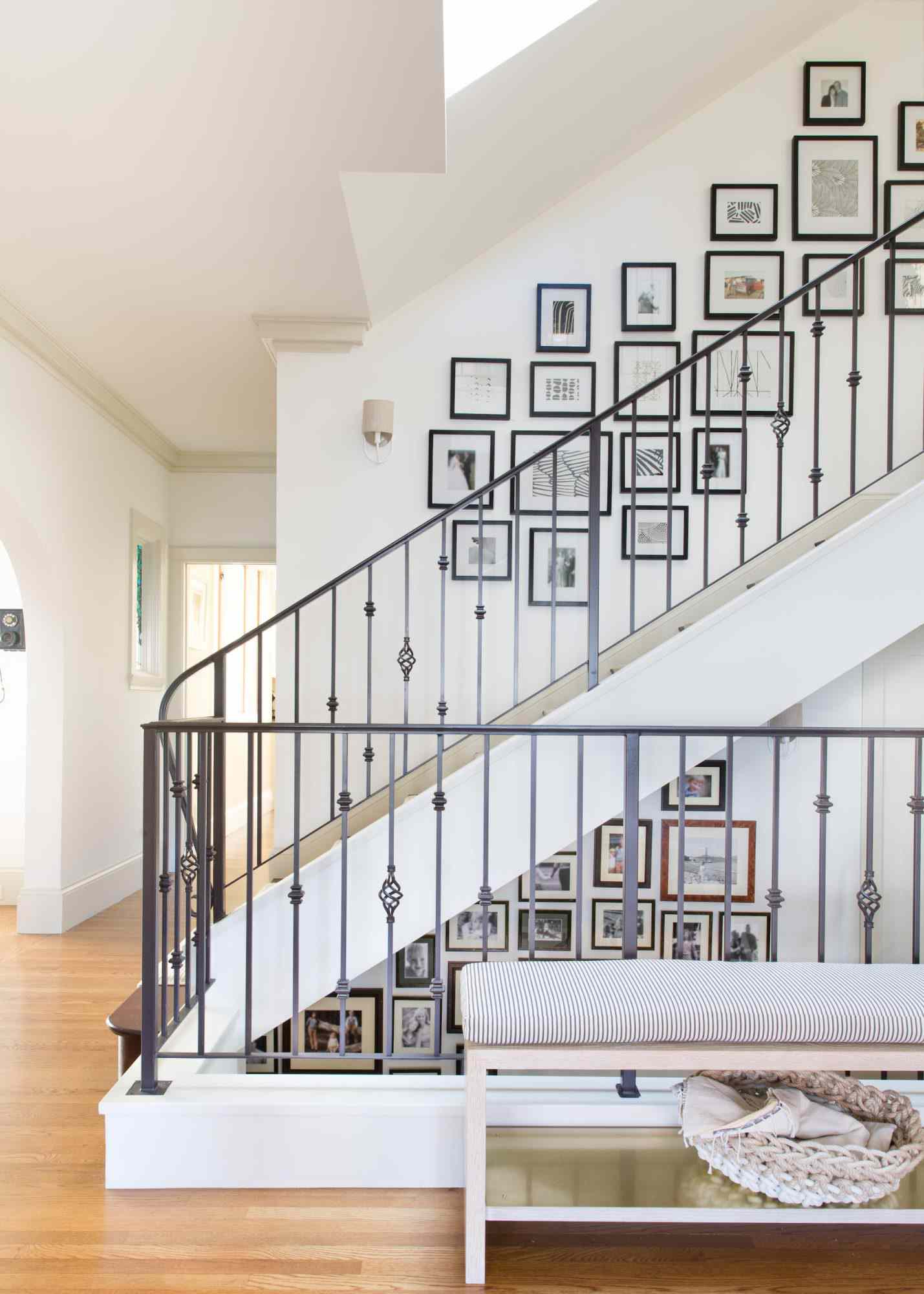 staircase with artwork on walls