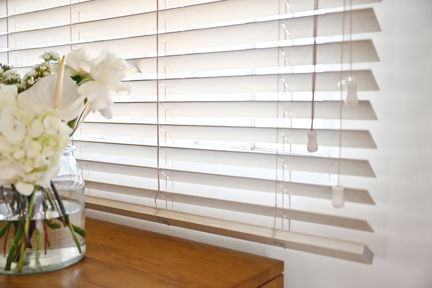 White window blinds on a white background