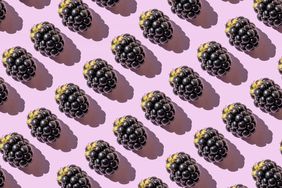 Repeated blackberries on the purple background