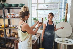 lesbian couple taking a ceramics class together for Valentine's Day