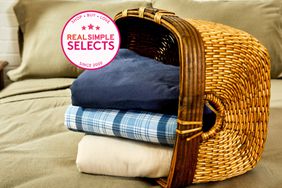 A variety of flannel sheets in a wooden basket