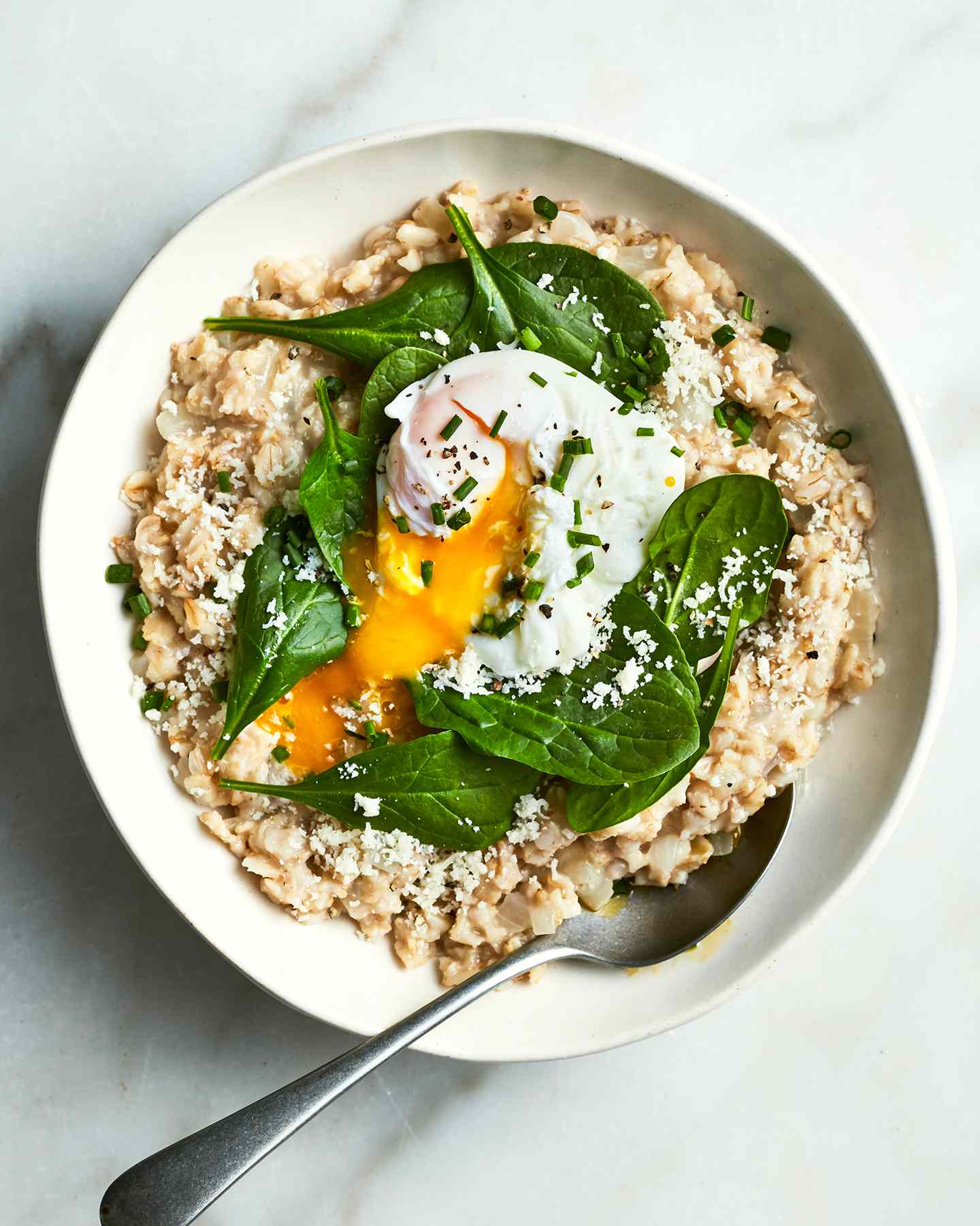 A savory oatmeal with egg and spinach is the breakfast you didn’t know you needed in your life. Get the recipe for Savory Oatmeal With Spinach and Poached Eggs.