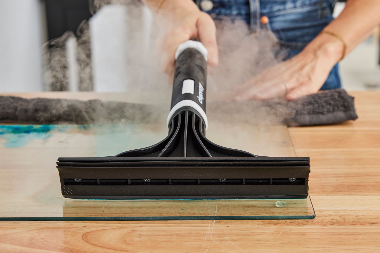 Close-up of the head of a Dupray One Steam Cleaner as it releases steam