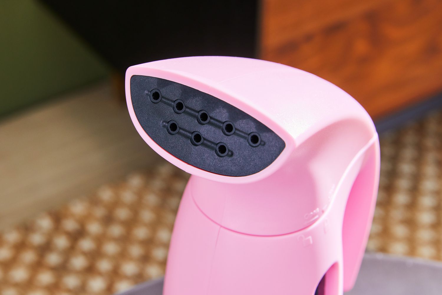 A close-up of the Brookline Handheld Garment Steamer's steam nozzle.