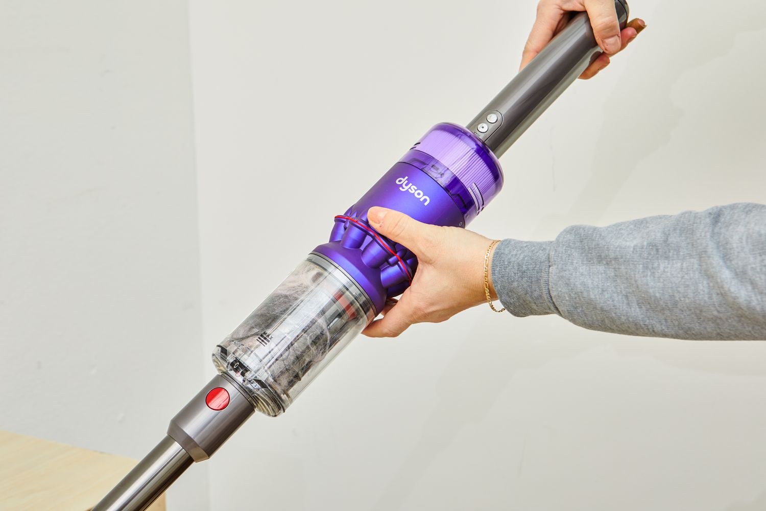 Person holding the Dyson Omni-Glide+ Cordless Vacuum