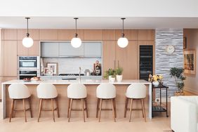 beautiful clean modern kitchen with bar stools