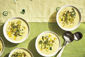 Top View of Five White Bowls of Green Gazpacho With Grapes, Honeydew, and Cucumber and Three Metal Spoons for Eating