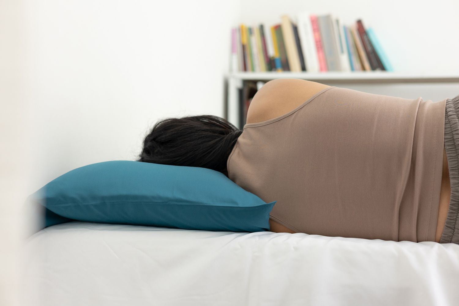 Person sleeping on Slumber Cloud Core Down Alternative Pillow on bed 