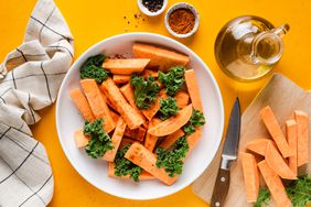 Foods for eye health: kale and sweet potatoes in a white bowl on a colorful background