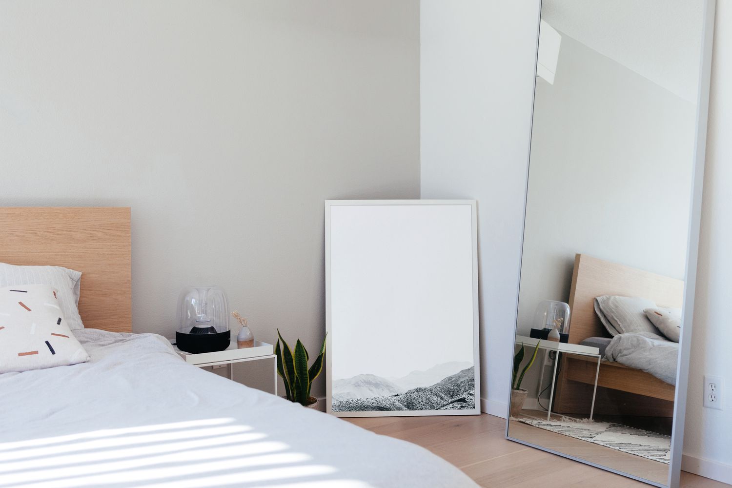 bedroom with standing mirrors on floor